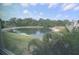 Peaceful water view from screened window at 948 Virginia St # 205, Dunedin, FL 34698