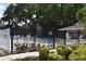 Inviting community pool with a surrounding fence and lush landscaping at 948 Virginia St # 205, Dunedin, FL 34698