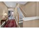 Interior view of a staircase with wood railing and carpet at 6226 Anhinga Pl, Tampa, FL 33615