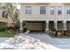 Townhouse exterior with covered parking and landscaping at 6226 Anhinga Pl, Tampa, FL 33615