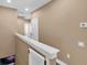 Upstairs hallway with neutral walls and doors to bedrooms at 6226 Anhinga Pl, Tampa, FL 33615