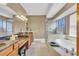 Elegant bathroom with double vanity, soaking tub, and walk-in shower at 6226 Anhinga Pl, Tampa, FL 33615