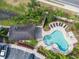 Community pool with lounge chairs and shaded seating at 6226 Anhinga Pl, Tampa, FL 33615