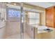Modern bathroom with a walk-in shower and a large soaking tub at 6226 Anhinga Pl, Tampa, FL 33615