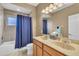 Clean bathroom with double vanity and a shower/tub combo at 6226 Anhinga Pl, Tampa, FL 33615