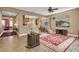 Living room with hardwood floors, TV, and access to balcony at 6226 Anhinga Pl, Tampa, FL 33615