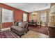 Formal dining room with hardwood floors and elegant chandelier at 6226 Anhinga Pl, Tampa, FL 33615