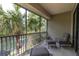 Relaxing screened balcony overlooking a tranquil pond at 6226 Anhinga Pl, Tampa, FL 33615
