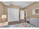 Bright bedroom with double doors leading to another room at 6226 Anhinga Pl, Tampa, FL 33615