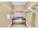Spacious walk-in closet with ample shelving and a center island at 6226 Anhinga Pl, Tampa, FL 33615