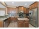 Modern kitchen featuring stainless steel appliances and ample cabinetry at 6226 Anhinga Pl, Tampa, FL 33615