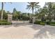 Gated entrance to community with brick pavers and landscaping at 6226 Anhinga Pl, Tampa, FL 33615