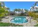 Community pool with lounge chairs and patio area at 6226 Anhinga Pl, Tampa, FL 33615