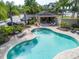 Inviting kidney-shaped pool with a relaxing patio area at 6226 Anhinga Pl, Tampa, FL 33615