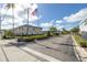 Community entrance with landscaping and flag at 5347 81St N Ln # 22, St Petersburg, FL 33709