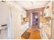 Bright kitchen with white cabinets, laminate flooring, and modern appliances at 5347 81St N Ln # 22, St Petersburg, FL 33709
