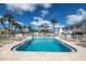 Community pool with plenty of lounge chairs at 5347 81St N Ln # 22, St Petersburg, FL 33709
