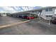 Covered parking area with cars parked in front of condo building at 5347 81St N Ln # 22, St Petersburg, FL 33709