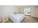 Bright bedroom with access to a sunroom and ample closet space at 5130 Brittany S Dr # 202, St Petersburg, FL 33715