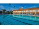 Inviting swimming pool with multiple lap lanes and plenty of lounge chairs at 5130 Brittany S Dr # 202, St Petersburg, FL 33715