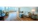 Bright living room with hardwood floors and water views at 5130 Brittany S Dr # 202, St Petersburg, FL 33715