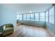 Sunlit living room with hardwood floors and water views at 5130 Brittany S Dr # 202, St Petersburg, FL 33715