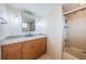 Updated bathroom with granite countertop vanity and a tub shower combo at 5130 Brittany S Dr # 202, St Petersburg, FL 33715