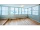 Bright sunroom with water views and wood floors at 5130 Brittany S Dr # 202, St Petersburg, FL 33715
