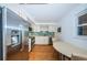 Modern kitchen with stainless steel appliances and teal tile at 5130 Brittany S Dr # 202, St Petersburg, FL 33715