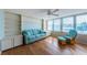 Living room with built-in shelving and water views at 5130 Brittany S Dr # 202, St Petersburg, FL 33715