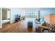 Hardwood floors, light walls, and a couch define this living room at 5130 Brittany S Dr # 202, St Petersburg, FL 33715