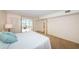 Spacious bedroom with carpet and access to a sunroom at 5130 Brittany S Dr # 202, St Petersburg, FL 33715