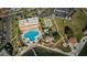 Aerial view of community pool, tennis courts, and waterfront access at 5130 Brittany S Dr # 202, St Petersburg, FL 33715