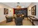 Comfortable reading room with bookshelves and armchairs at 675 S Gulfview Blvd # 903, Clearwater Beach, FL 33767