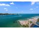 Expansive waterfront view with beach, boats, and distant buildings at 675 S Gulfview Blvd # 903, Clearwater Beach, FL 33767