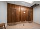 Simple hallway with wooden walls and tiled floor at 675 S Gulfview Blvd # 903, Clearwater Beach, FL 33767
