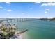 Stunning aerial view of the property's waterfront location and nearby bridge at 675 S Gulfview Blvd # 903, Clearwater Beach, FL 33767