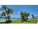 Tropical backyard oasis with lush landscaping and a waterfront view at 675 S Gulfview Blvd # 903, Clearwater Beach, FL 33767