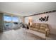 Living room with water views and comfortable seating at 675 S Gulfview Blvd # 903, Clearwater Beach, FL 33767