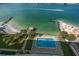 Aerial view showing the property's pool, beach access, and stunning waterfront location at 675 S Gulfview Blvd # 903, Clearwater Beach, FL 33767