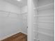Walk-in closet with organized wire shelving for efficient storage space at 2500 Winding Creek Blvd # A102, Clearwater, FL 33761