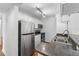 Modern kitchen features stainless steel appliances and ample counter space at 2500 Winding Creek Blvd # A102, Clearwater, FL 33761