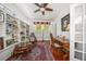 Charming home office with built-in shelving and hardwood floors at 327 Lotus Path, Clearwater, FL 33756