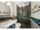 Nautical-themed bathroom with walk-in shower and mosaic tile at 327 Lotus Path, Clearwater, FL 33756