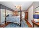 Comfortable bedroom with a four-poster bed and hardwood floors at 327 Lotus Path, Clearwater, FL 33756