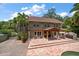 Exterior of two story house featuring a large patio and pergola at 327 Lotus Path, Clearwater, FL 33756