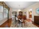 Elegant dining room featuring hardwood floors and a view to the kitchen at 327 Lotus Path, Clearwater, FL 33756