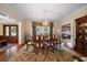 Formal dining room with a large table and hardwood floors at 327 Lotus Path, Clearwater, FL 33756