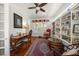 Bright and airy home office with built-in shelving and hardwood floors at 327 Lotus Path, Clearwater, FL 33756