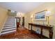 Elegant entryway with hardwood floors and a grand staircase at 327 Lotus Path, Clearwater, FL 33756
